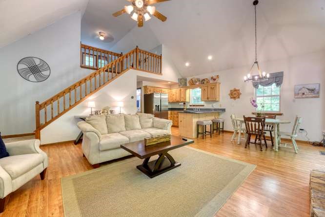 3333 Ellington Road Hayesville, NC 28904 - Photo 30 of 56 a living room with furniture kitchen view and a chandelier