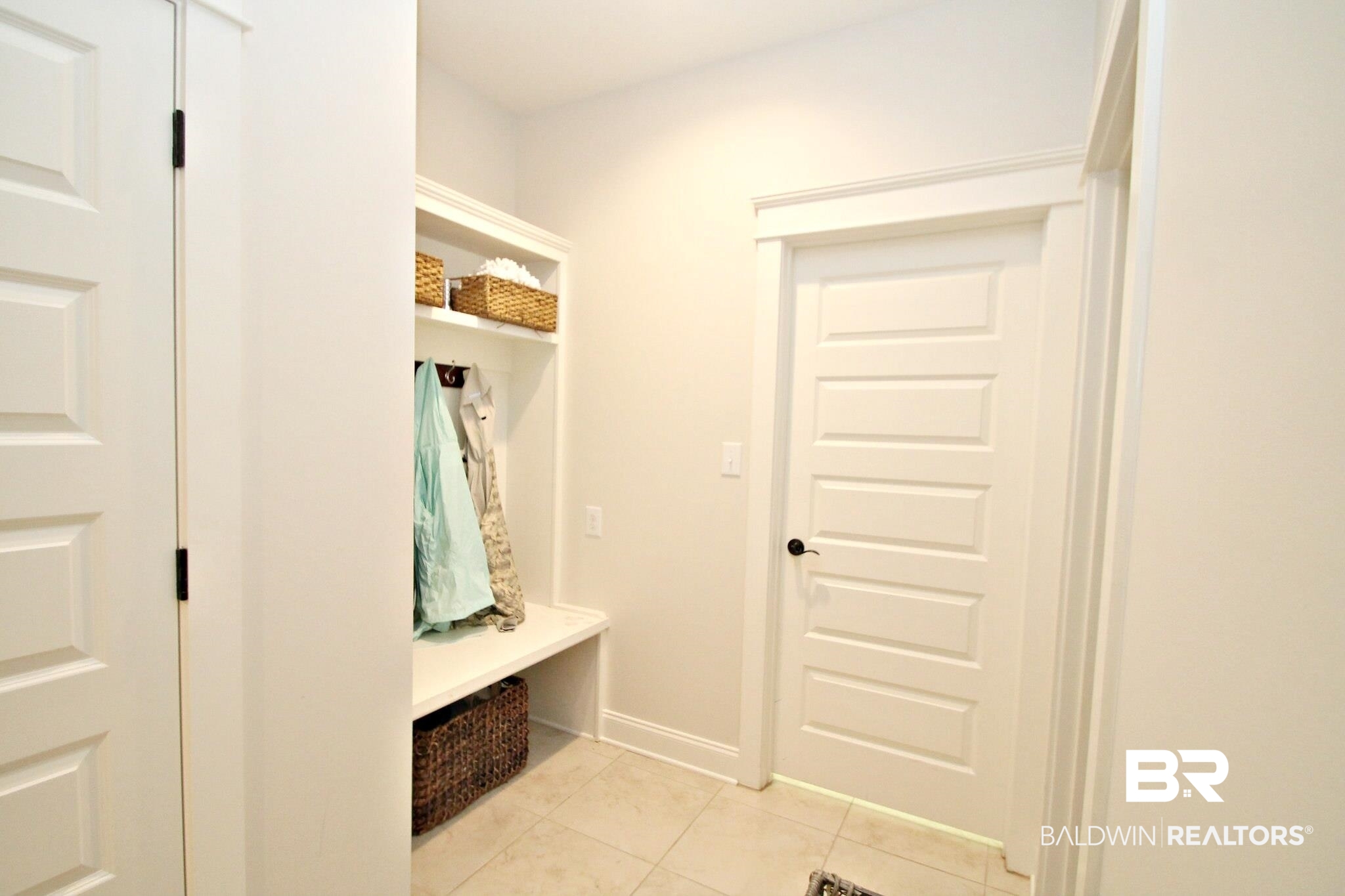30232 Persimmon Drive Daphne, AL 36527 - Photo 19 of 27 Mudroom featuring light tile patterned floors and baseboards