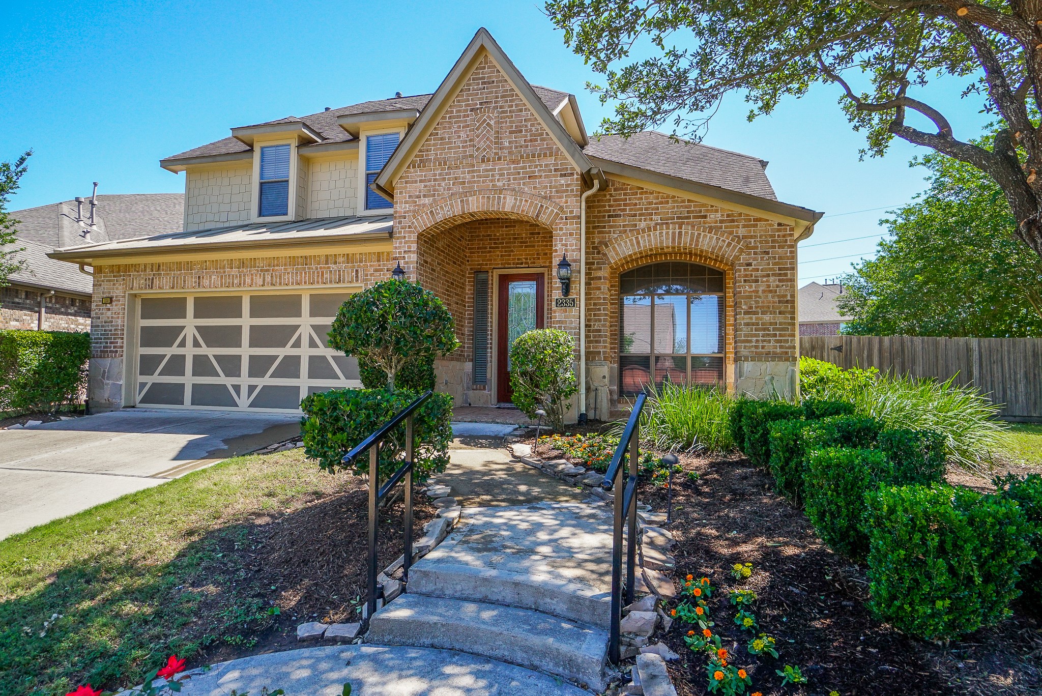 2335 Ralston Branch Way Sugar Land, TX 77479 - Photo 6 of 47 a front view of a house with garden