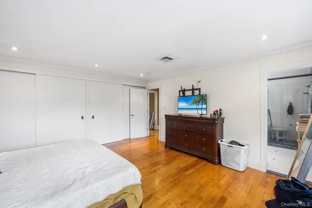 a bed room with a bed and a dresser