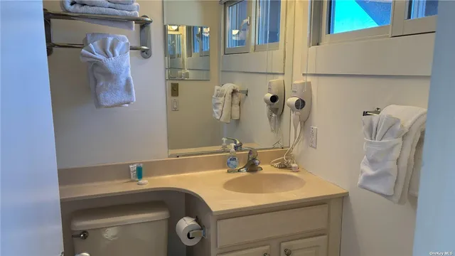 a bathroom with a sink and mirror