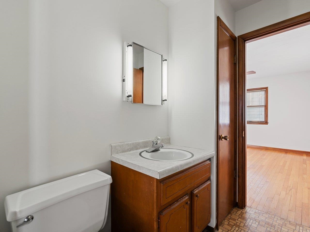 3602 14th Avenue Moline, IL 61265 - Photo 13 of 36 a bathroom with a sink toilet and vanity