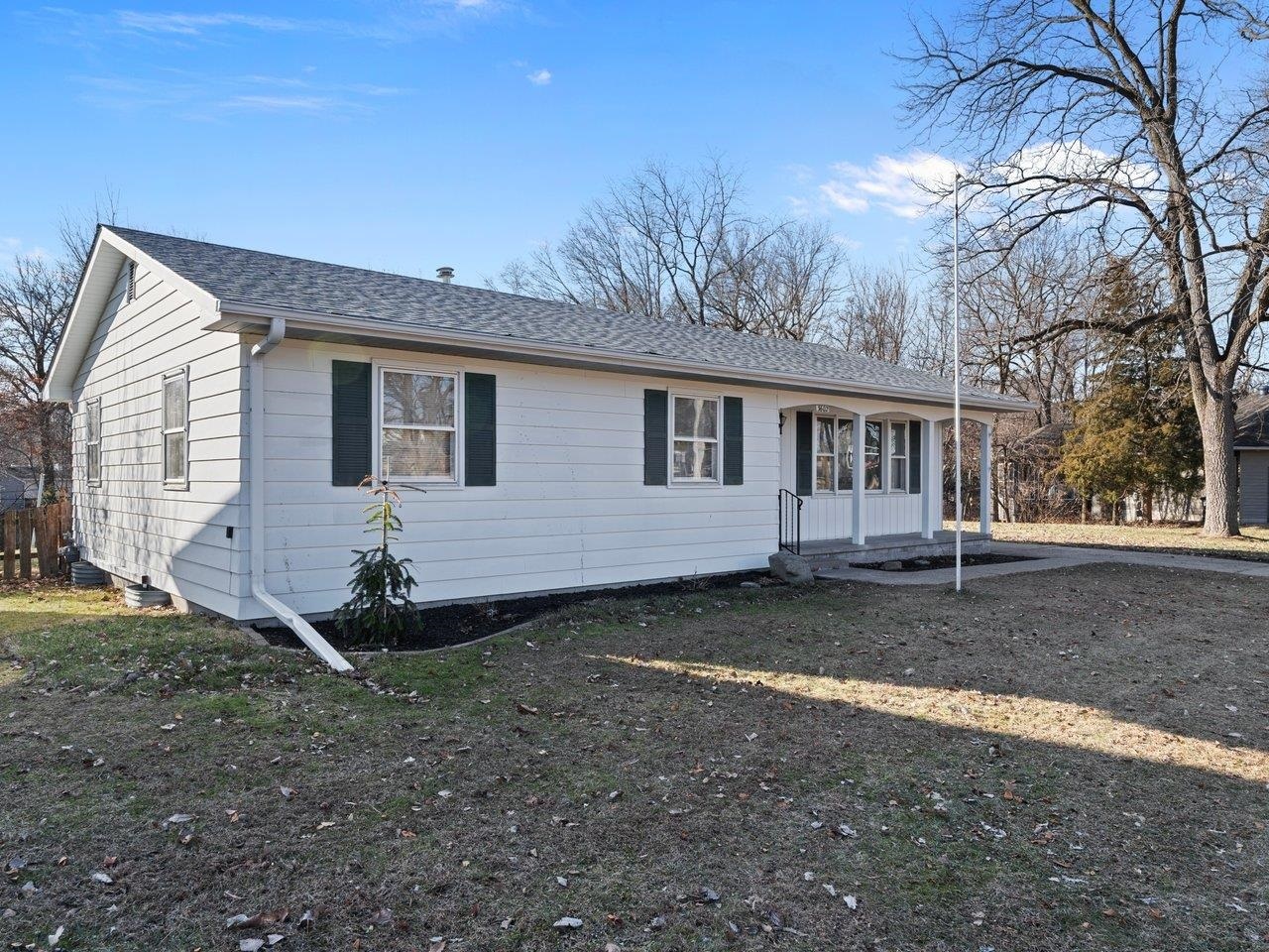 3602 14th Avenue Moline, IL 61265 - Photo 2 of 36 a view of a house with backyard and trees