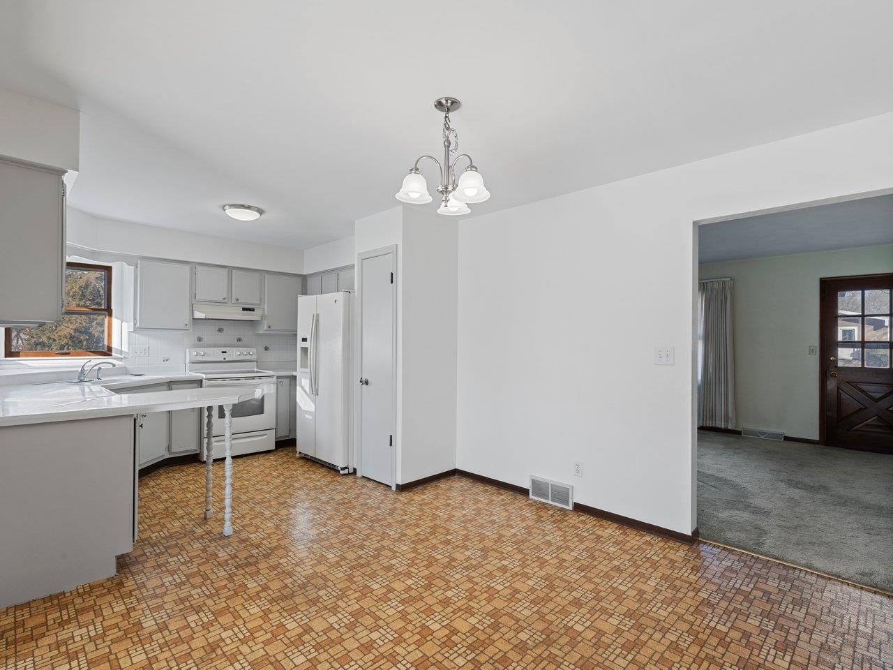 3602 14th Avenue Moline, IL 61265 - Photo 22 of 36 a kitchen with white cabinets and sink