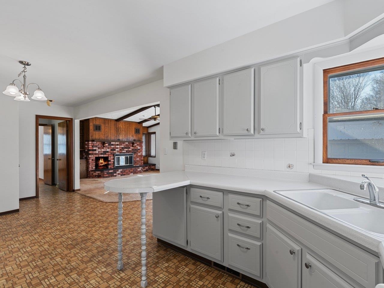 3602 14th Avenue Moline, IL 61265 - Photo 26 of 36 a kitchen with stainless steel appliances granite countertop a sink and cabinets