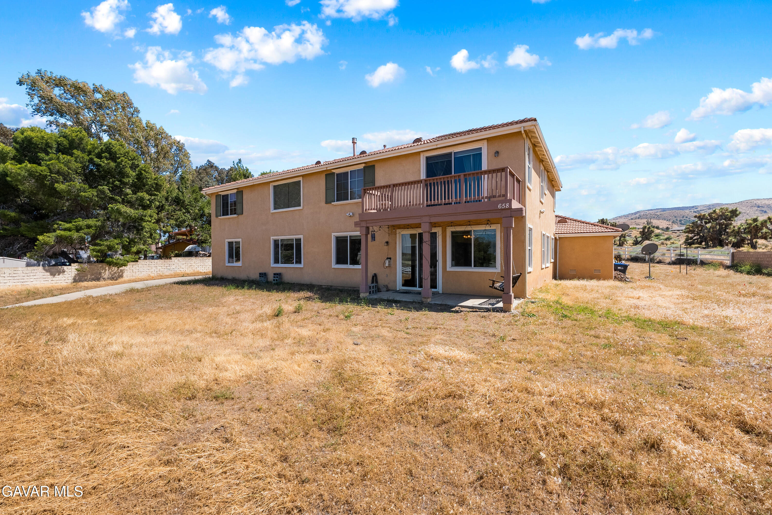 658 Lago Lindo Road Palmdale, CA 93550 - Photo 73 of 91 a front view of a house with a yard