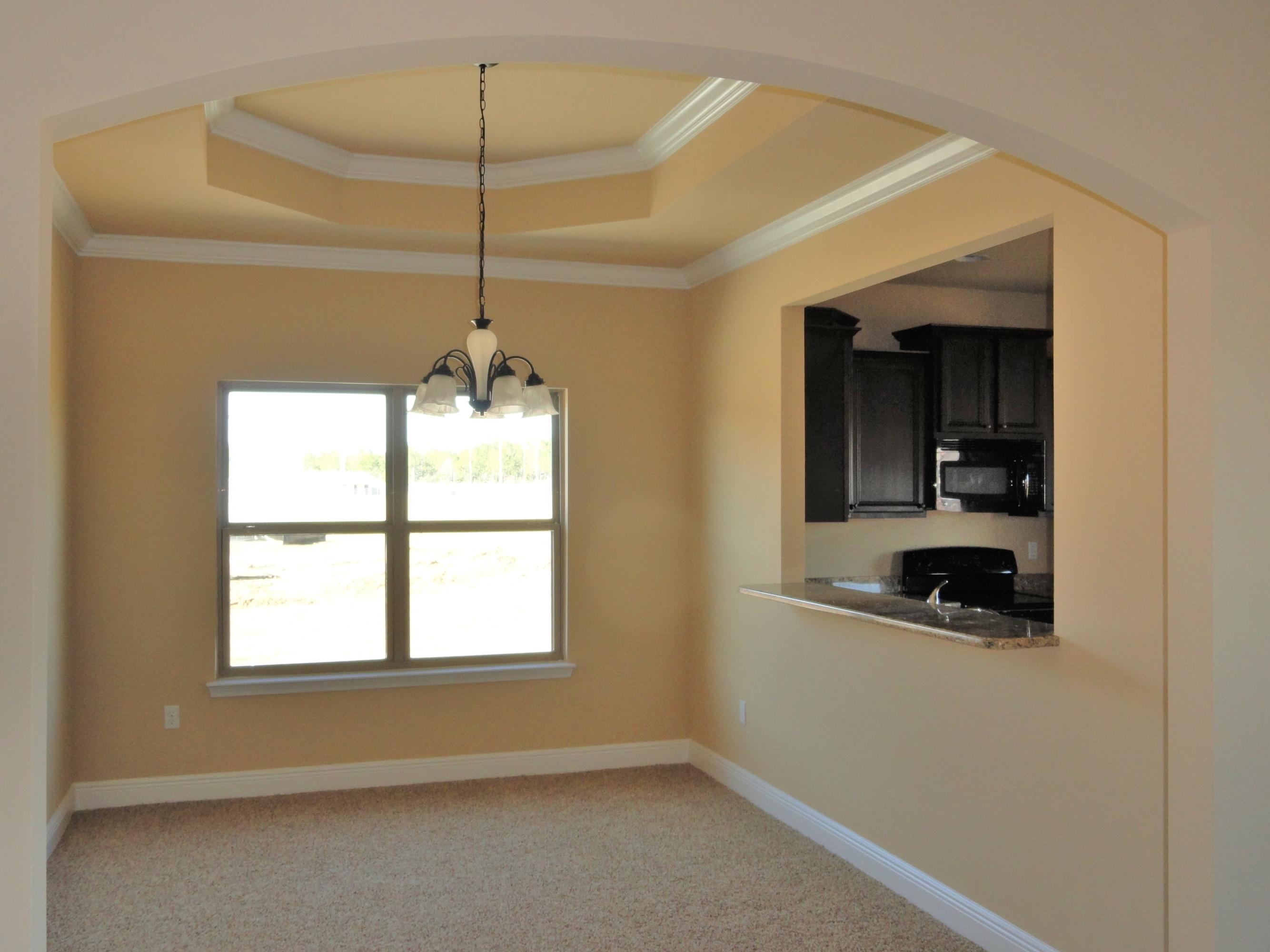 3443 Brownstone Road Crestview, FL 32539 - Photo 3 of 6 a room with window and a chandelier
