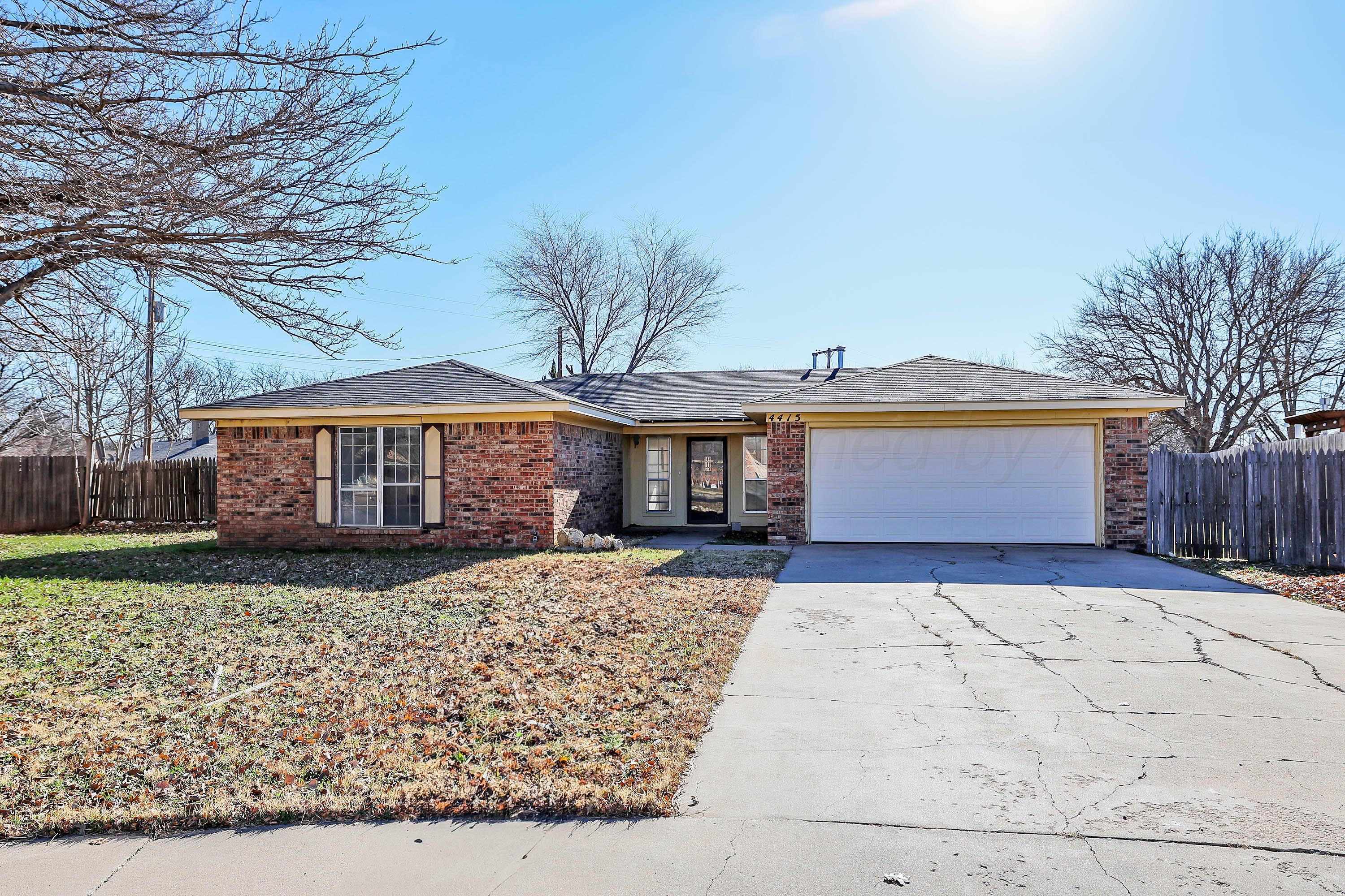 4415 Kingston Road Amarillo, TX 79109 - Photo 1 of 26 a front view of a house with garden