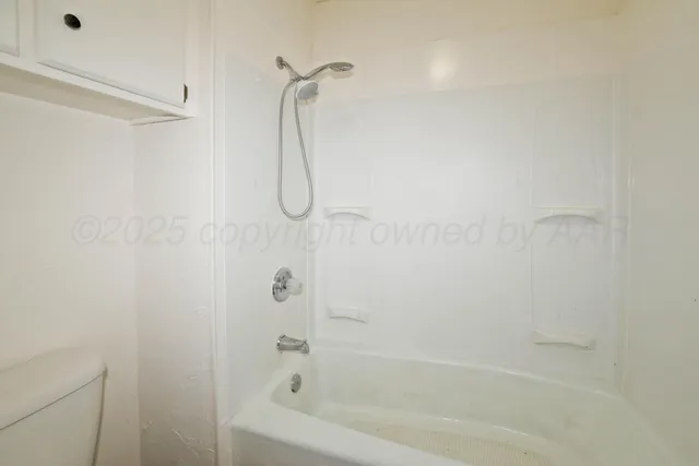 a close up of a bathtub curtain