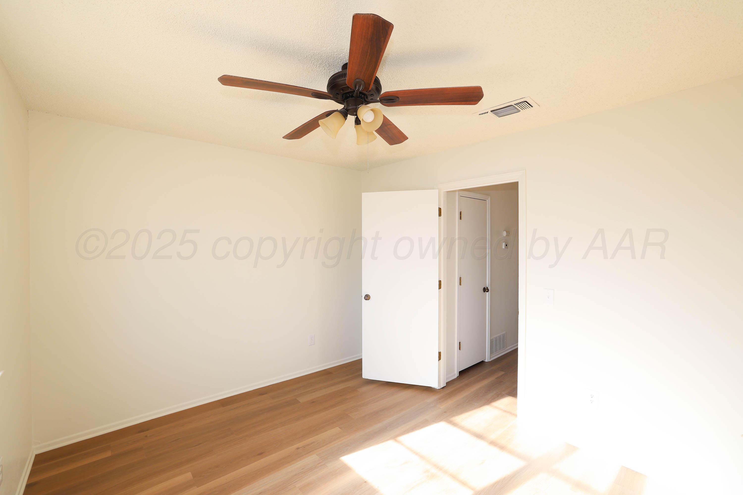 4415 Kingston Road Amarillo, TX 79109 - Photo 18 of 26 a view of a room with a ceiling fan