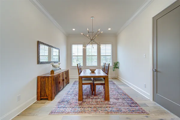 a kitchen with kitchen island granite countertop a sink cabinets and stainless steel appliances