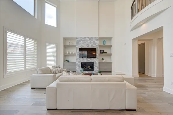 a spacious bathroom with a double vanity sink a mirror and a bathtub