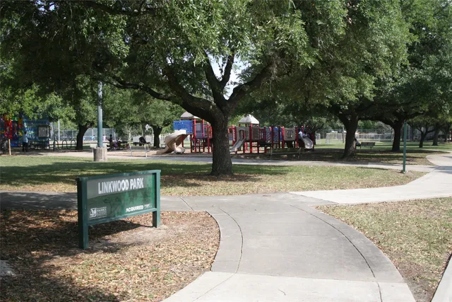 a view of swimming pool with sitting area and garden