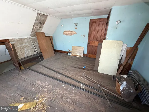 a view of a gym with wooden floor