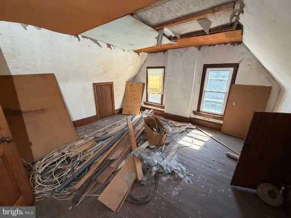 a room with furniture and mirror