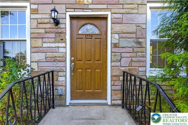 a view of a wooden door of the house