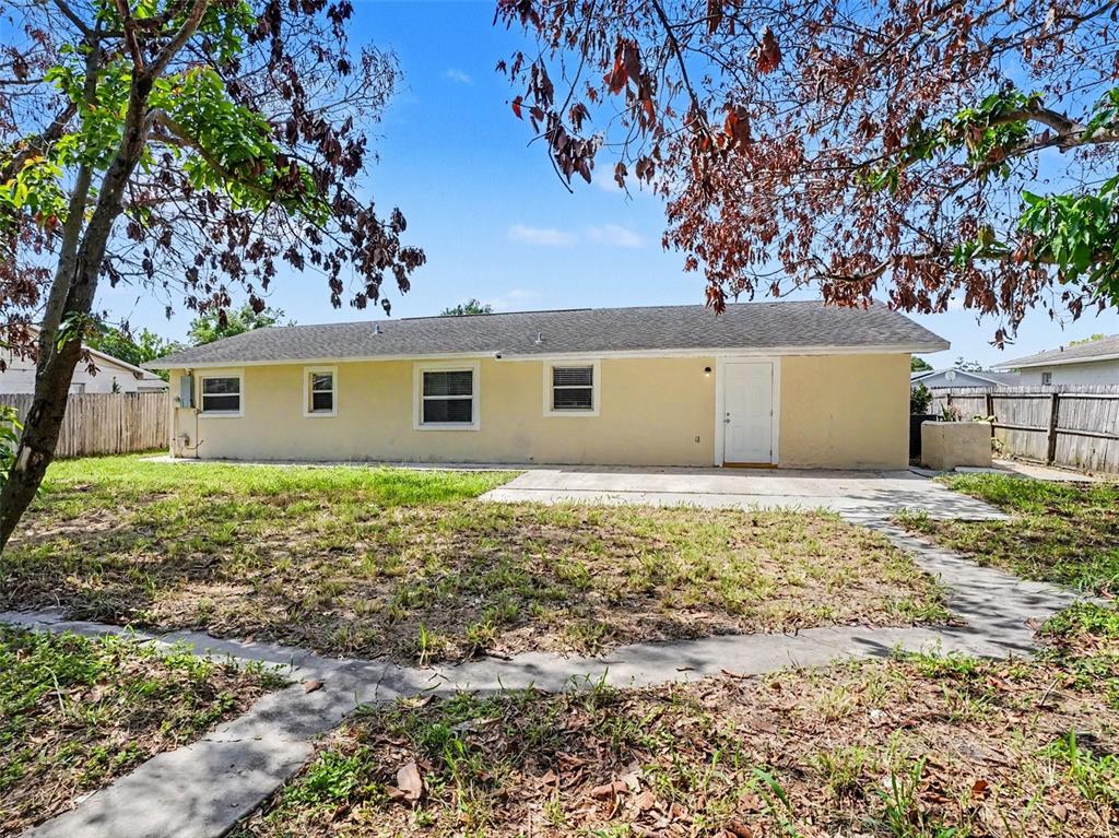 615 Thomas Jefferson Way Orlando, FL 32809 - Photo 17 of 17 front view of a house with a yard
