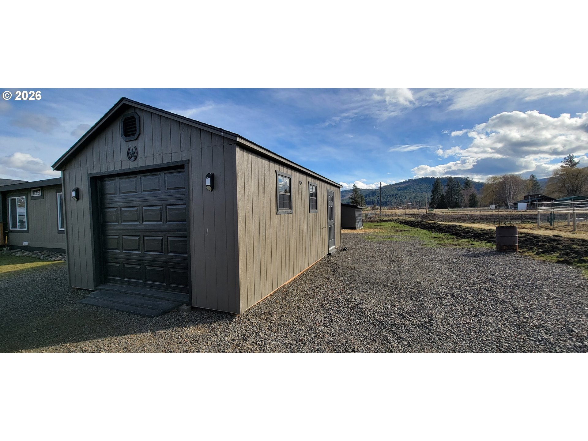 70724 Bear Creek Road Wallowa, OR 97885 - Photo 17 of 44 a view of a house with a yard