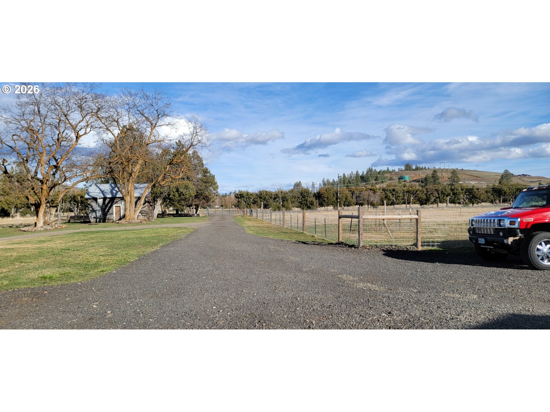 70724 Bear Creek Road Wallowa, OR 97885 - Photo 29 of 44 a view of a cars park on the side of building