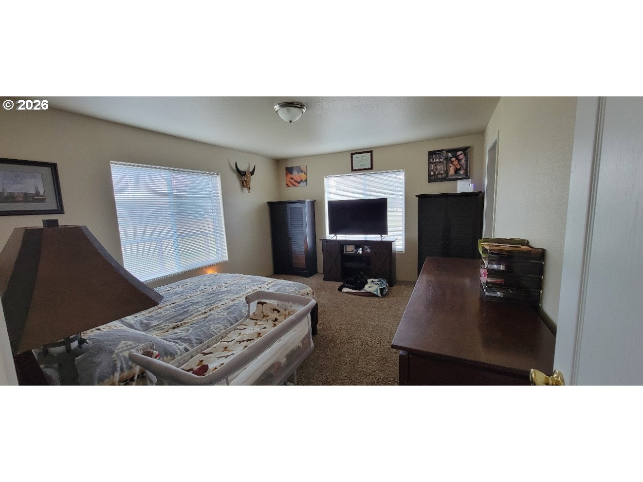 70724 Bear Creek Road Wallowa, OR 97885 - Photo 9 of 44 a living room with furniture and a flat screen tv