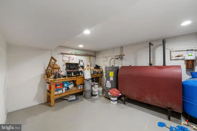 a bedroom with furniture and a baby bed