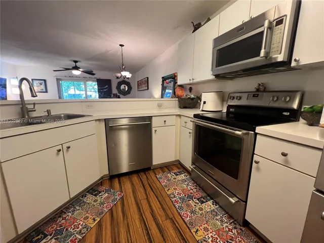 a kitchen with a stove oven and sink