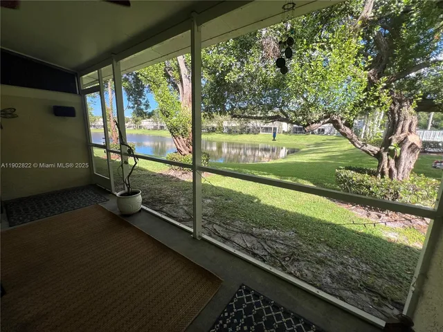 a view of a yard with wooden floor