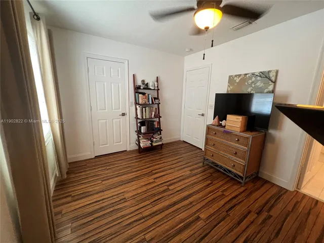 a view of workspace with furniture and wooden floor