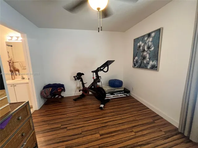 a room with wooden floor and furniture