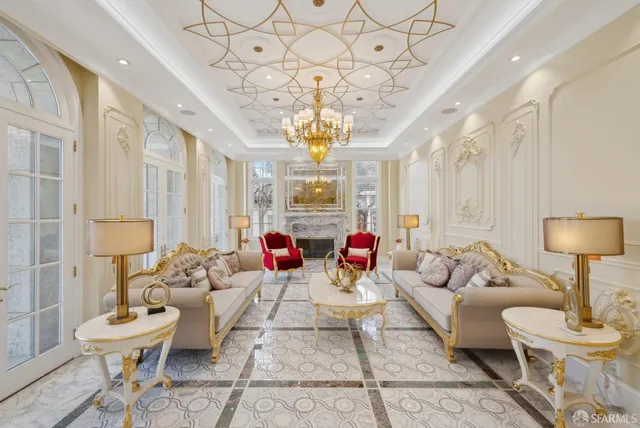 a kitchen with a stove a table and chairs in it