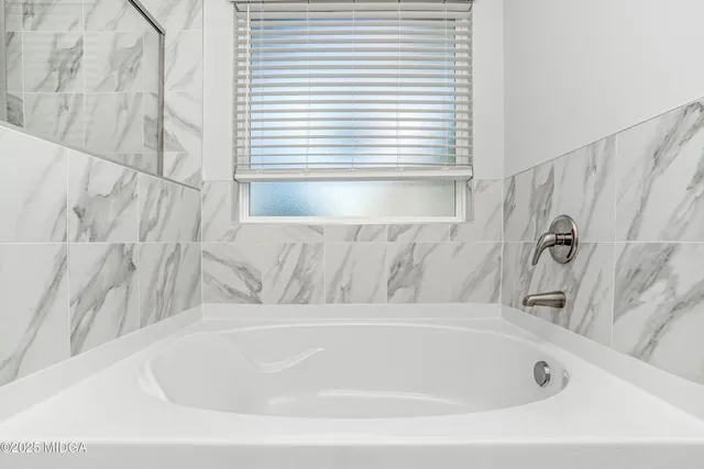 a bathroom with a bathtub