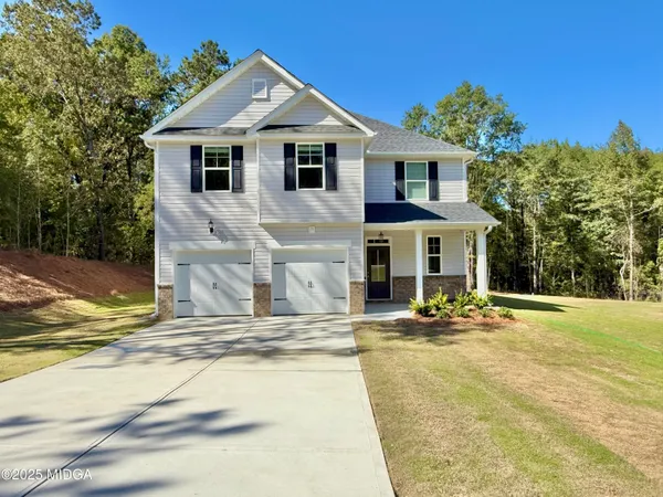 a front view of a house with a patio