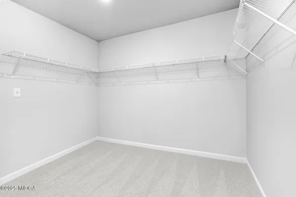 a view of an empty walk in closet