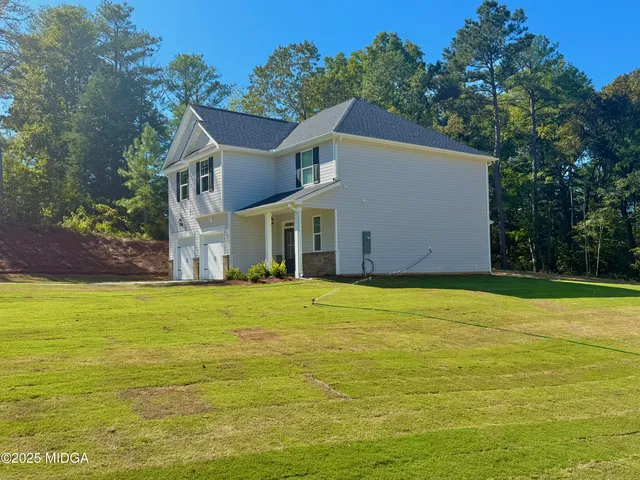 a house with trees in the background
