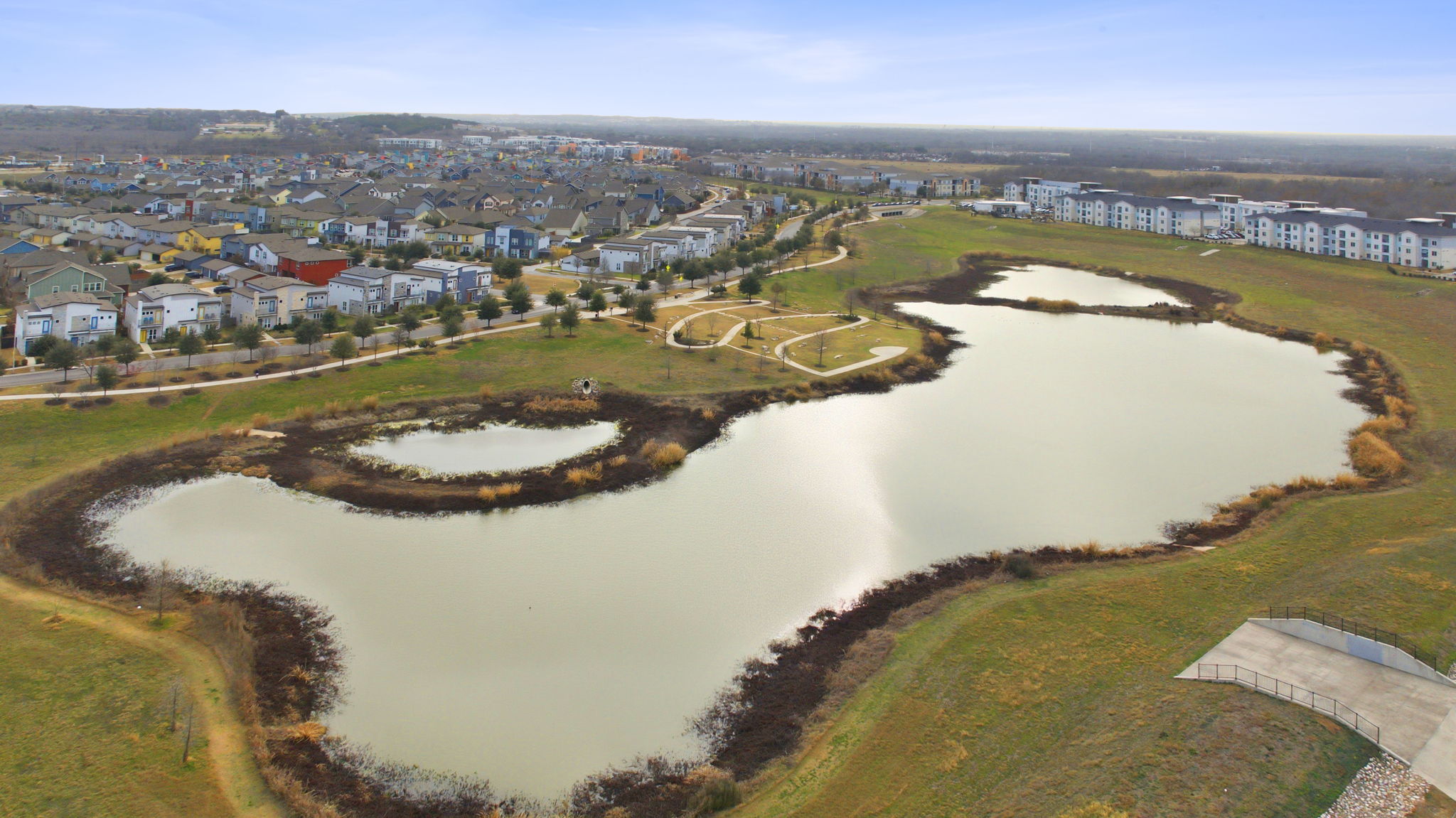 6005 Baythorne Drive Austin, TX 78747 - Photo 37 of 40 Aerial view of residential area with a large body of water