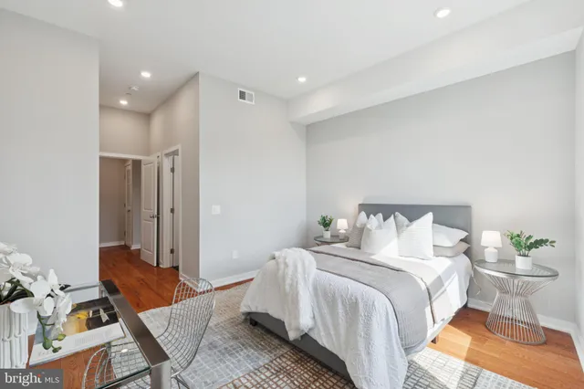 a bedroom with a bed and a table