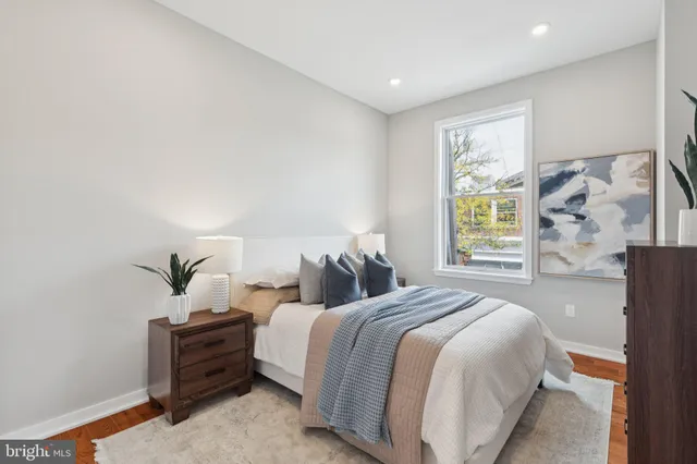 a bedroom with bed and a window