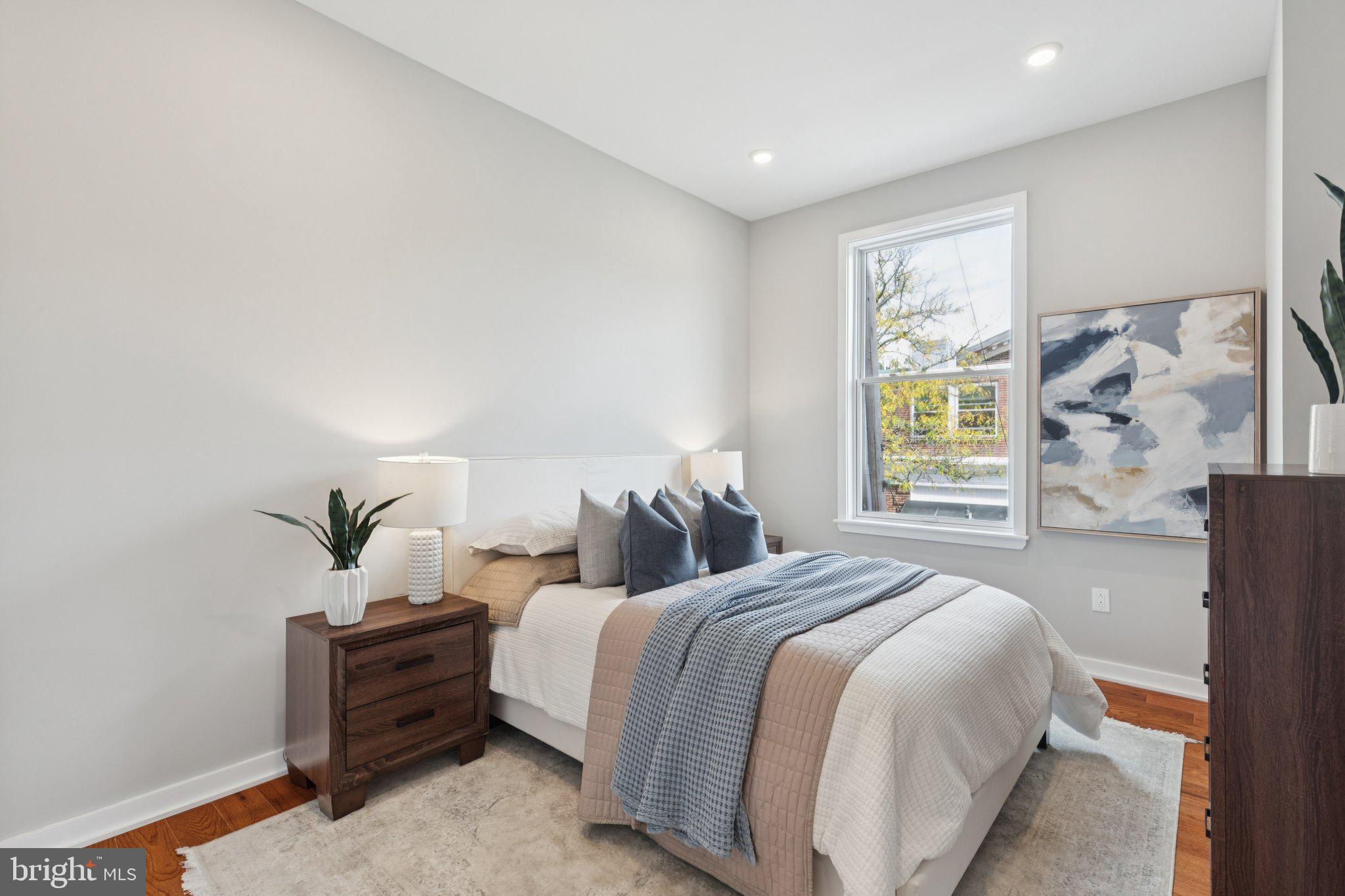100 Forrest Avenue, Unit 203 Narberth, PA 19072 - Photo 19 of 29 a bedroom with bed and a window