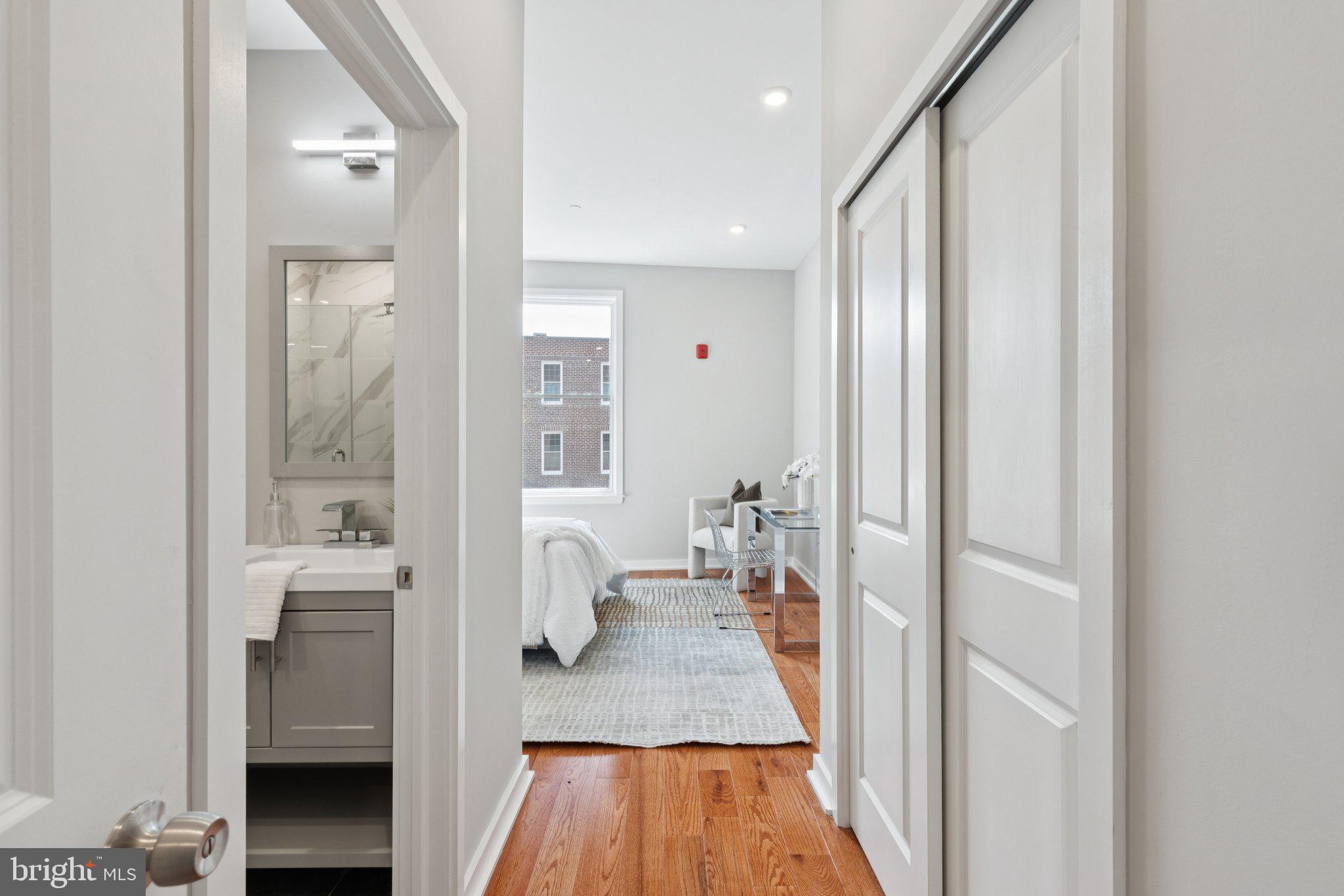 100 Forrest Avenue, Unit 203 Narberth, PA 19072 - Photo 24 of 29 a bathroom with a sink and a mirror