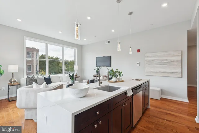 a kitchen with granite countertop a sink and a cabinets