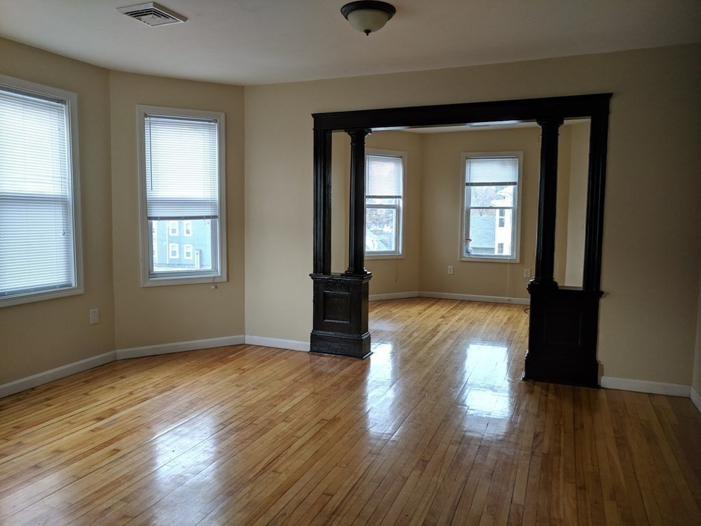 121 Winfield Street Worcester, MA 01602 - Photo 16 of 42 a view of empty room with wooden floor and fan