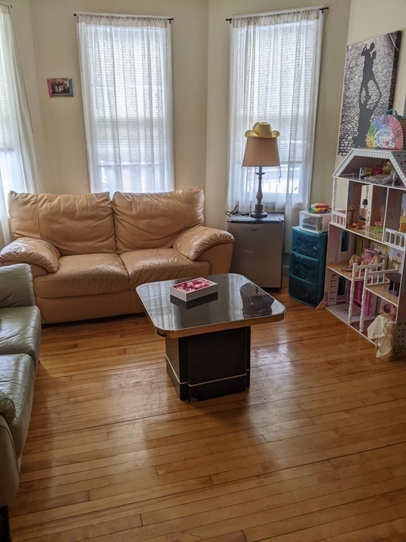 121 Winfield Street Worcester, MA 01602 - Photo 20 of 42 a living room with furniture and a large window