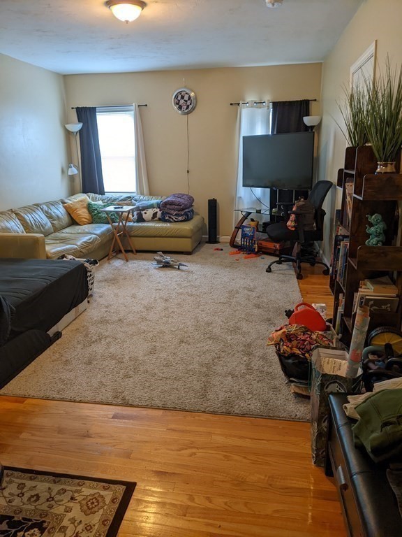 121 Winfield Street Worcester, MA 01602 - Photo 21 of 42 a living room with furniture and a flat screen tv