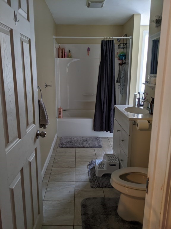 121 Winfield Street Worcester, MA 01602 - Photo 25 of 42 a bathroom with sink toilet and mirror