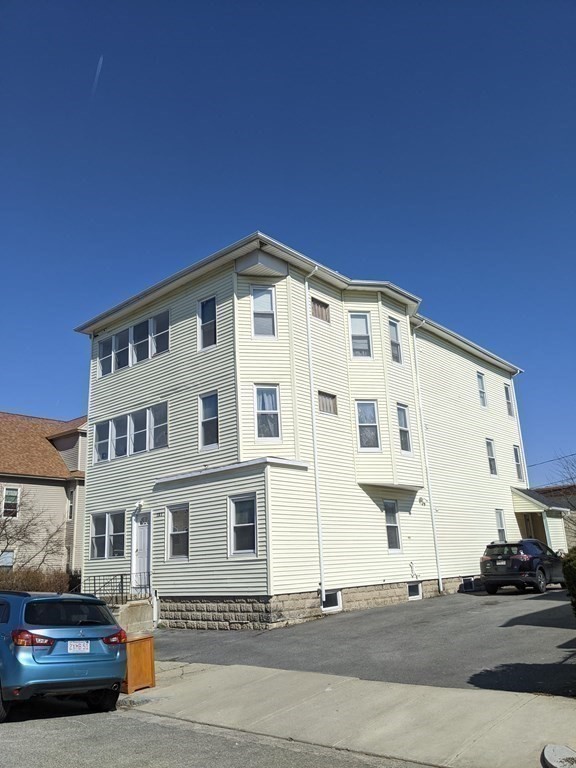 121 Winfield Street Worcester, MA 01602 - Photo 3 of 42 a front view of a building with lot of cars and parked