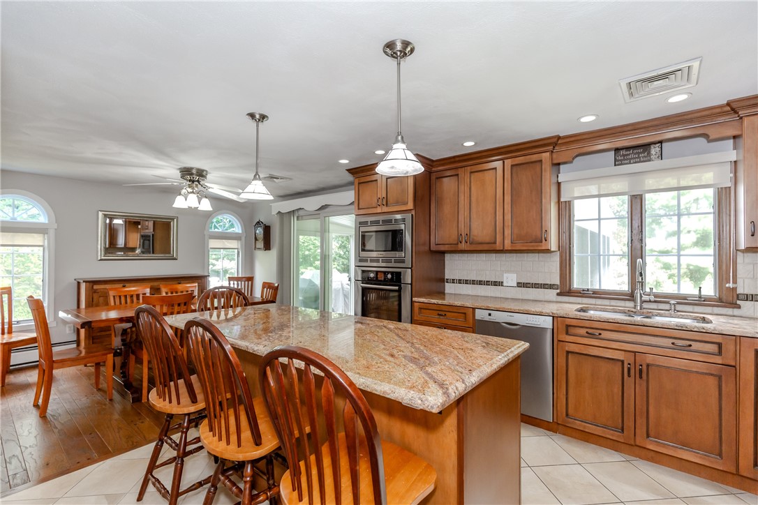 99 Tower Hill Road Cumberland, RI 02864 - Photo 7 of 43 Kitchen conveniently facing the dining area, creating an open and inviting flow for entertaining.
