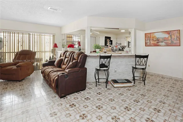 a bedroom with bed and a window