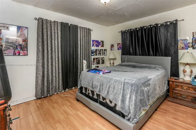 a kitchen with a refrigerator a stove a sink and a window