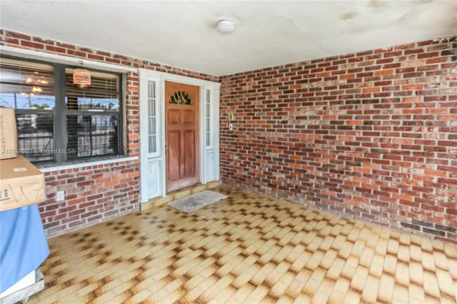 a bed room with a bed and a chandelier