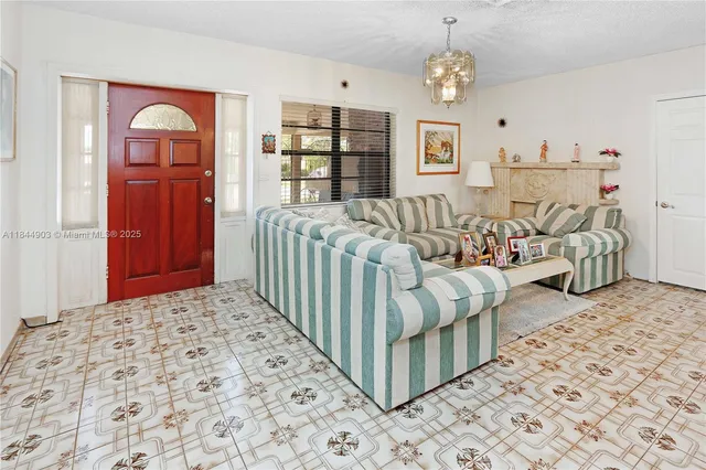 a dining room with a table and chairs